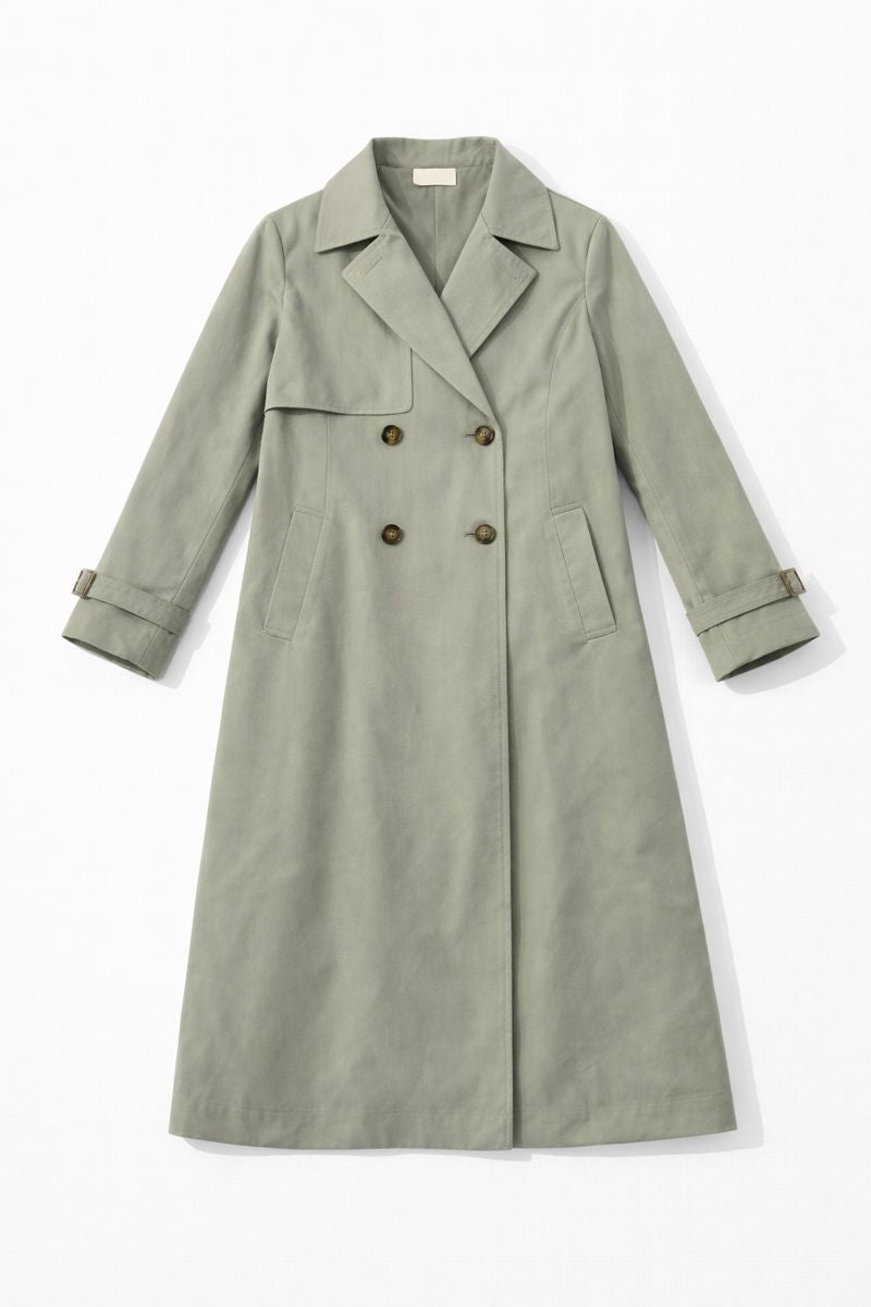 Double-breasted trench coat with large collar, raglan sleeves, back pleat, and matching belt