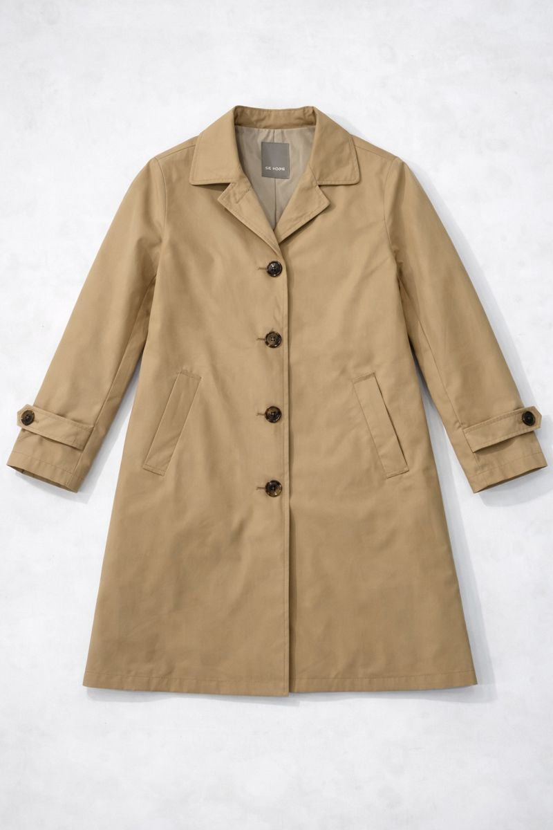 Loose-fit mac coat with pointed collar, concealed buttons, and front pockets