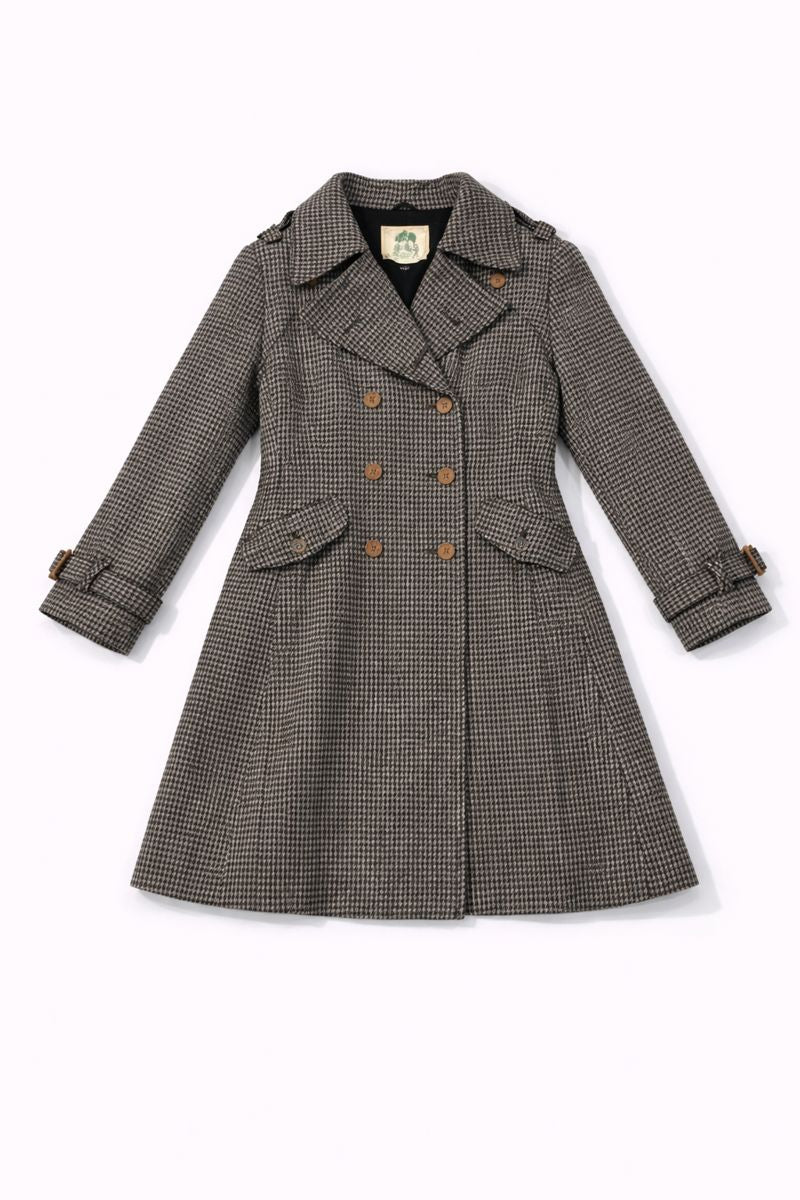 Double-breasted houndstooth coat with flared silhouette, flap pockets, and adjustable cuff straps