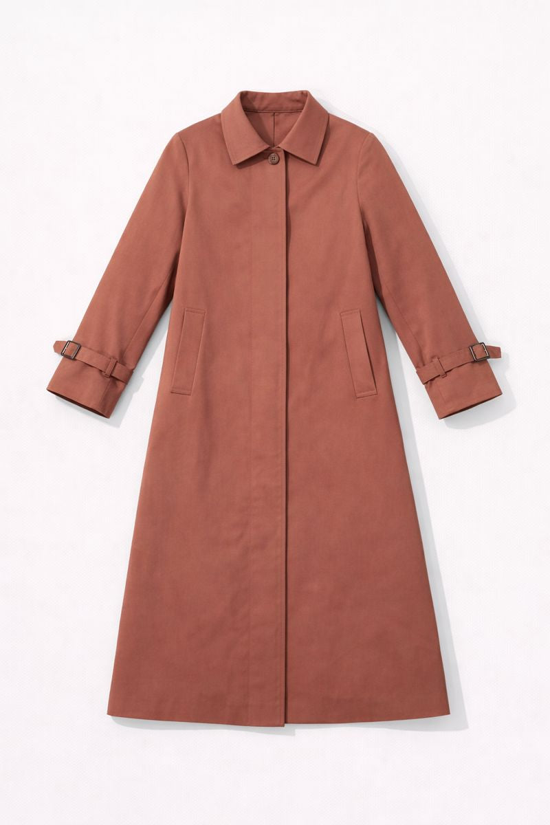 Women? A-line waterproof rain coat with button front and adjustable cuffs