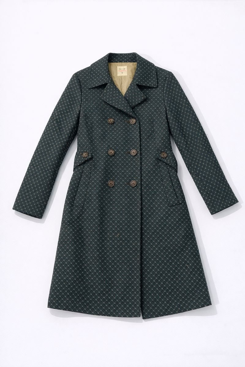 Double-breasted polka dot coat with flap pockets and fabric-covered buttons