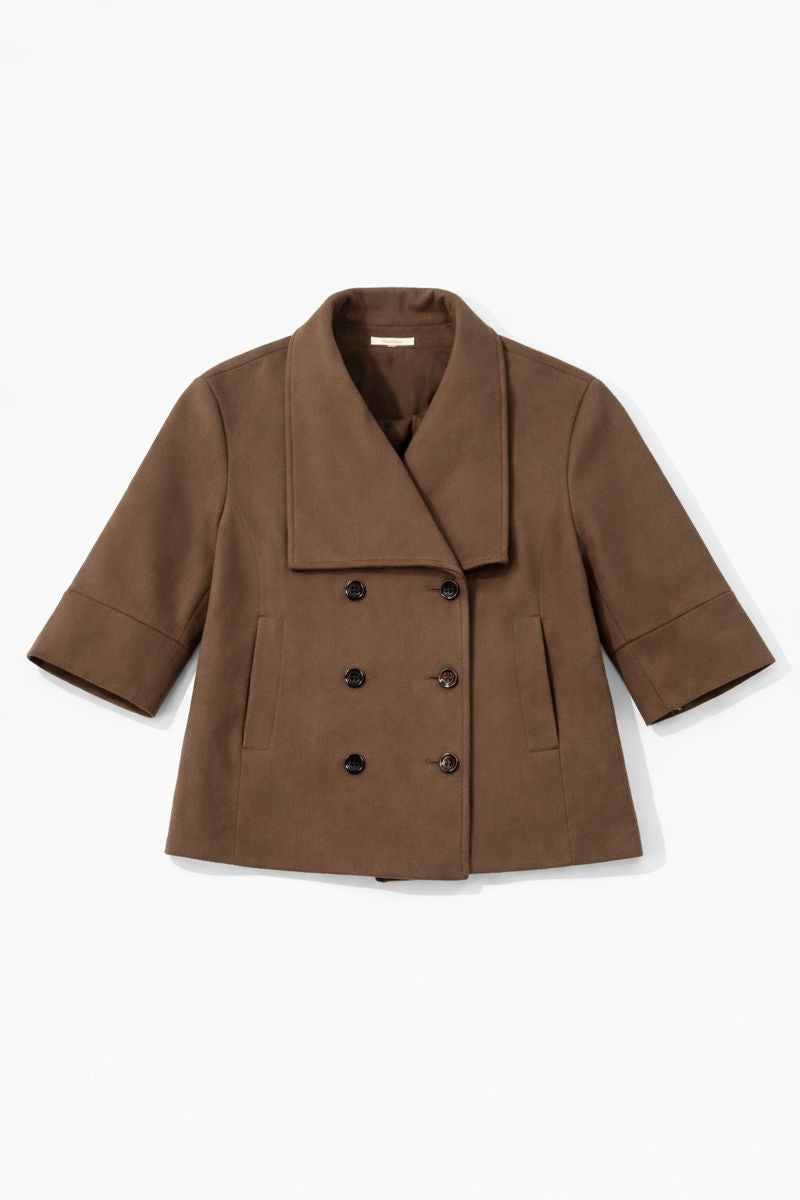 Cropped double-breasted coat with oversized collar, wide cuffs, and patch pockets