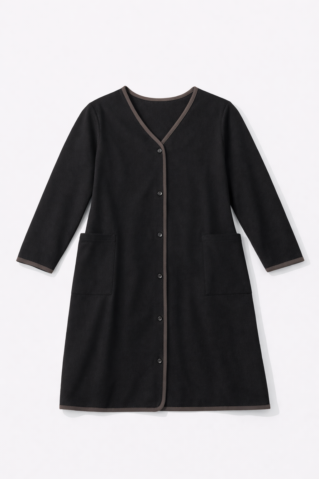 Dark coat with beige contrast trim and patch pockets