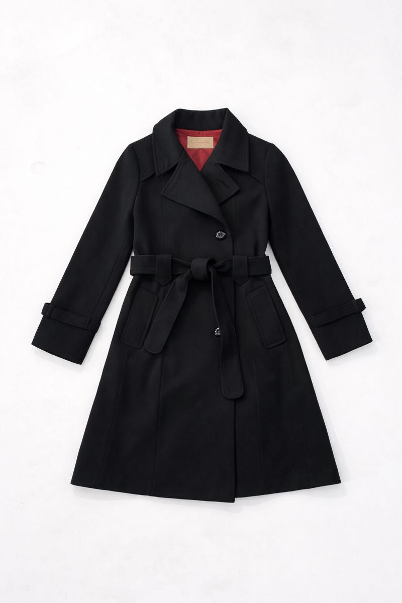 Double-breasted trench coat with belted waist, wide collar, and patch pockets
