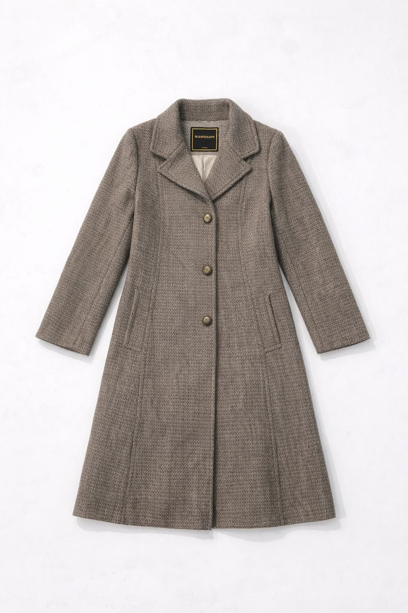 Single-breasted A-line coat with notched lapels, three-button closure, and vertical slit pockets