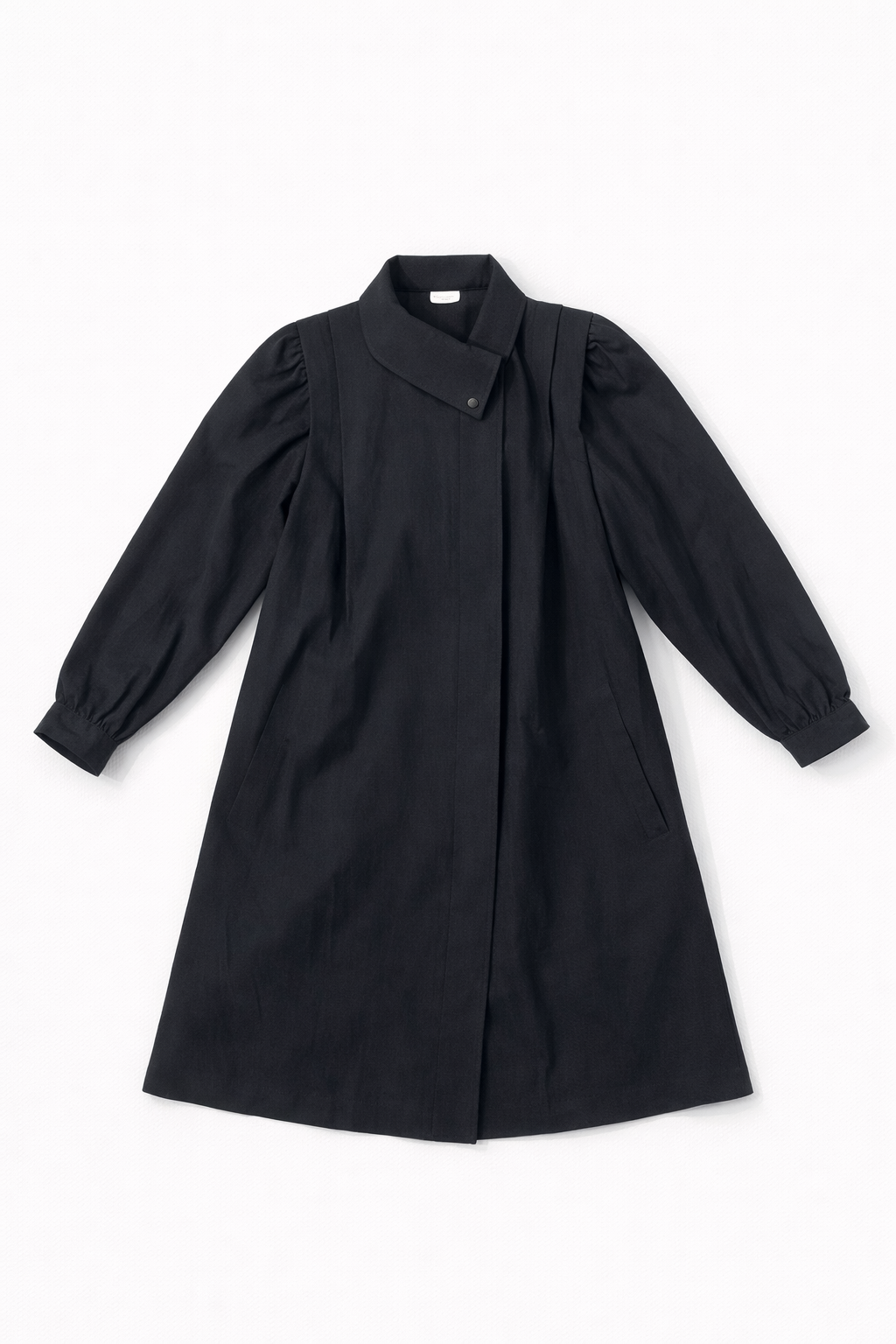 Grey tailored coat with clean lapels and structured silhouette