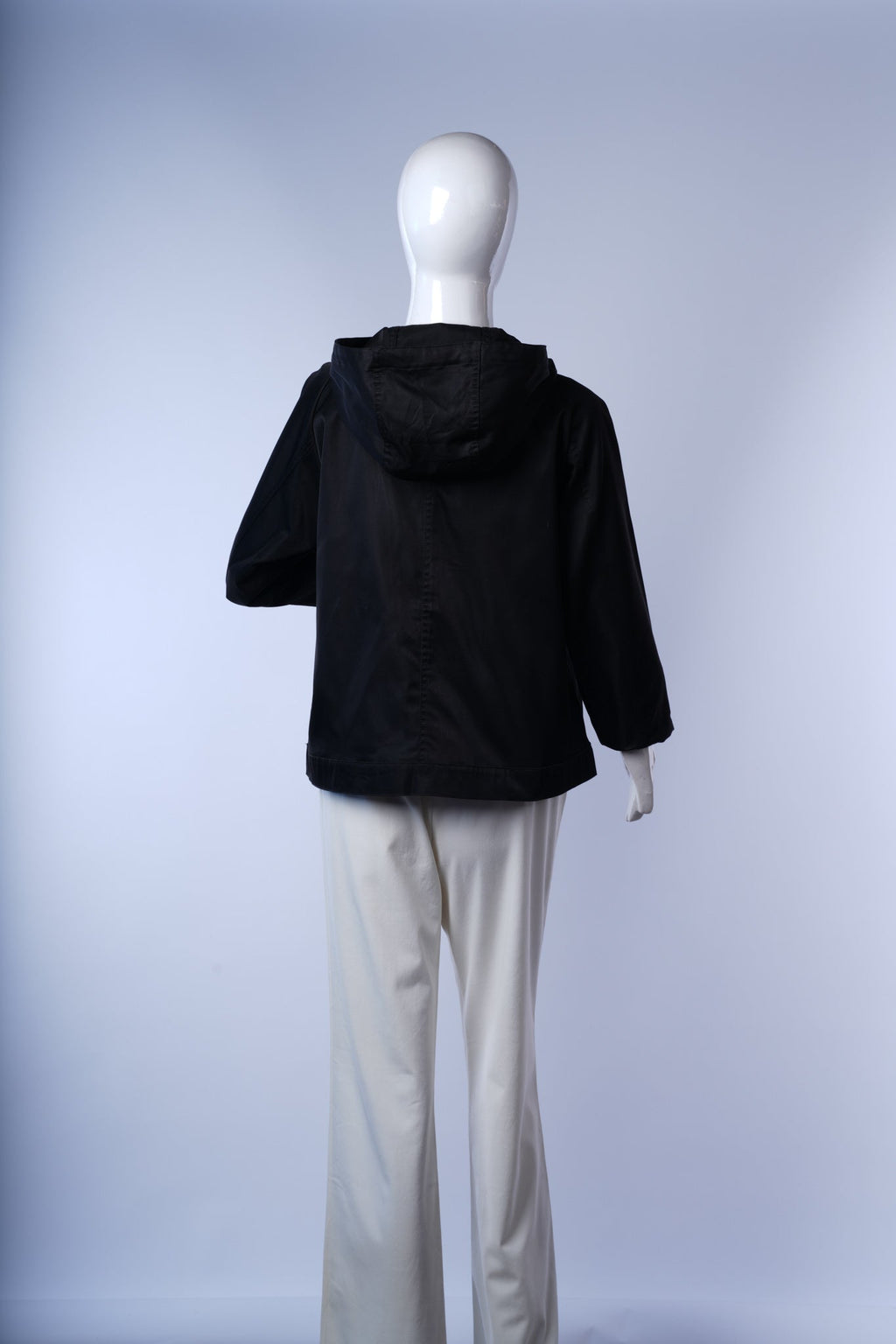 Black hooded jacket by Ray Cassin made from smooth, durable fabric with subtle sheen