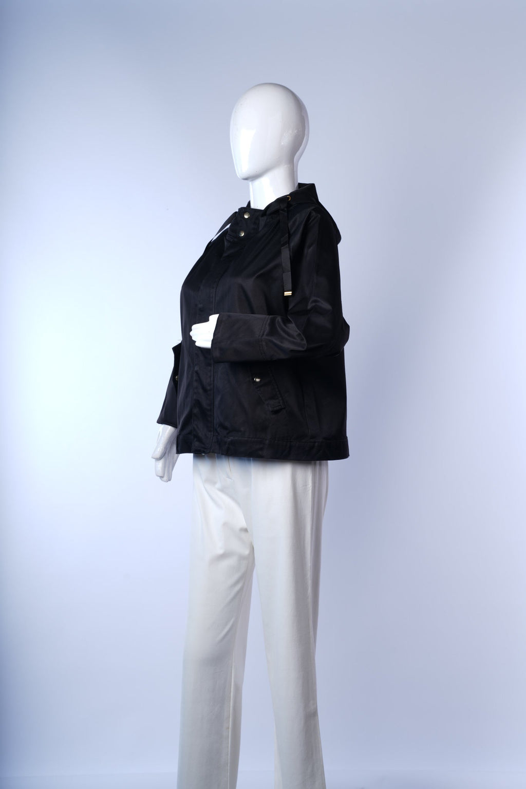 Modern black hooded jacket with sleek design and subtle shine by Ray Cassin