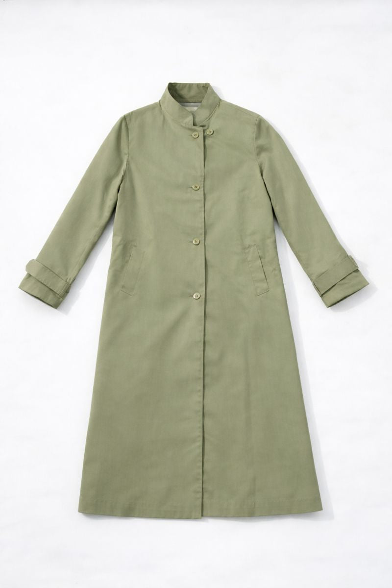 Knee-length light sage green coat with high stand-up collar and button-front closure
